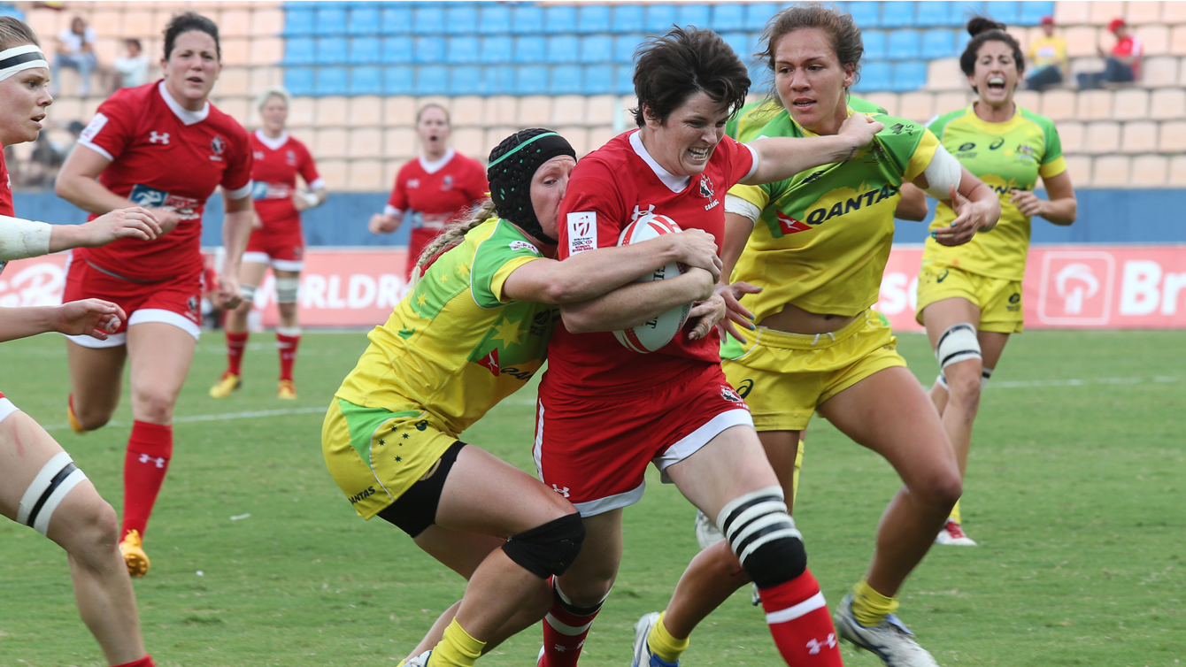 Britt Benn being tackled by Australian players during pool match in Sao Paulo on February 20, 2016.