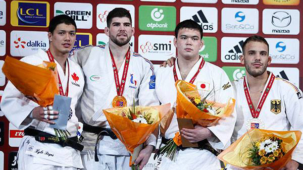 Kyle Reyes, left celebrates after finishing second in the men's 100kg at the Paris Grand Slam on February 7, 2016. Photo: International Judo Federation