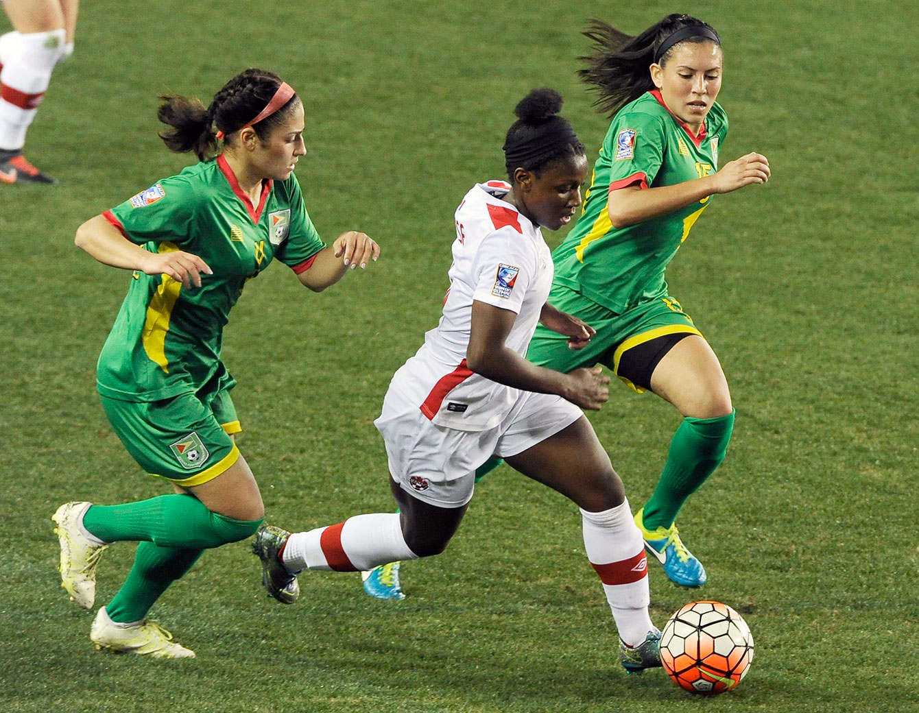 Deanne Rose (in white) against Guyana on February 11, 2016 in a CONCACAF women's Olympic qualifying match. 