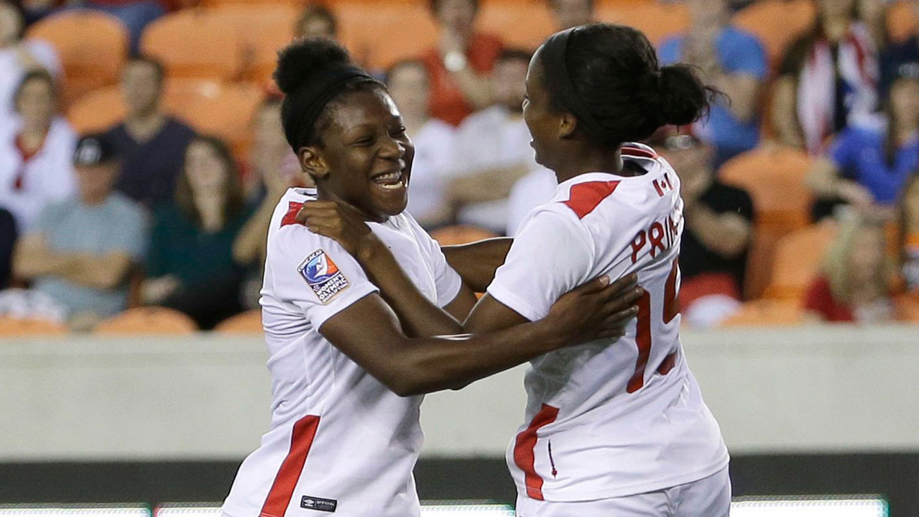 Deanne Rose (left) and Nichelle Prince celebrate Rose's goal in the Olympic qualifying tournament against Costa Rica on February 19, 2016.