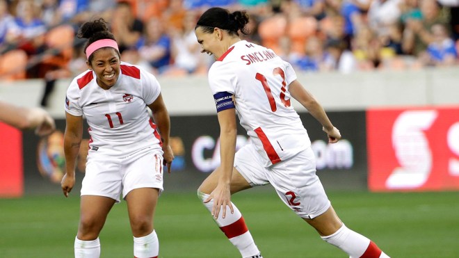 Christine Sinclair (right) celebrates her second goal against Costa Rica in Olympic qualifying with Desiree Scott looking on - February 19, 2016.