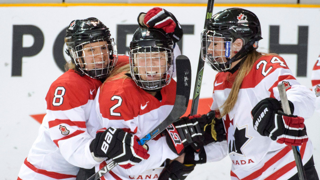 Meghan Agosta (2) is congratulated after her goal at the IIHF women's world championship on April 3, 2016.