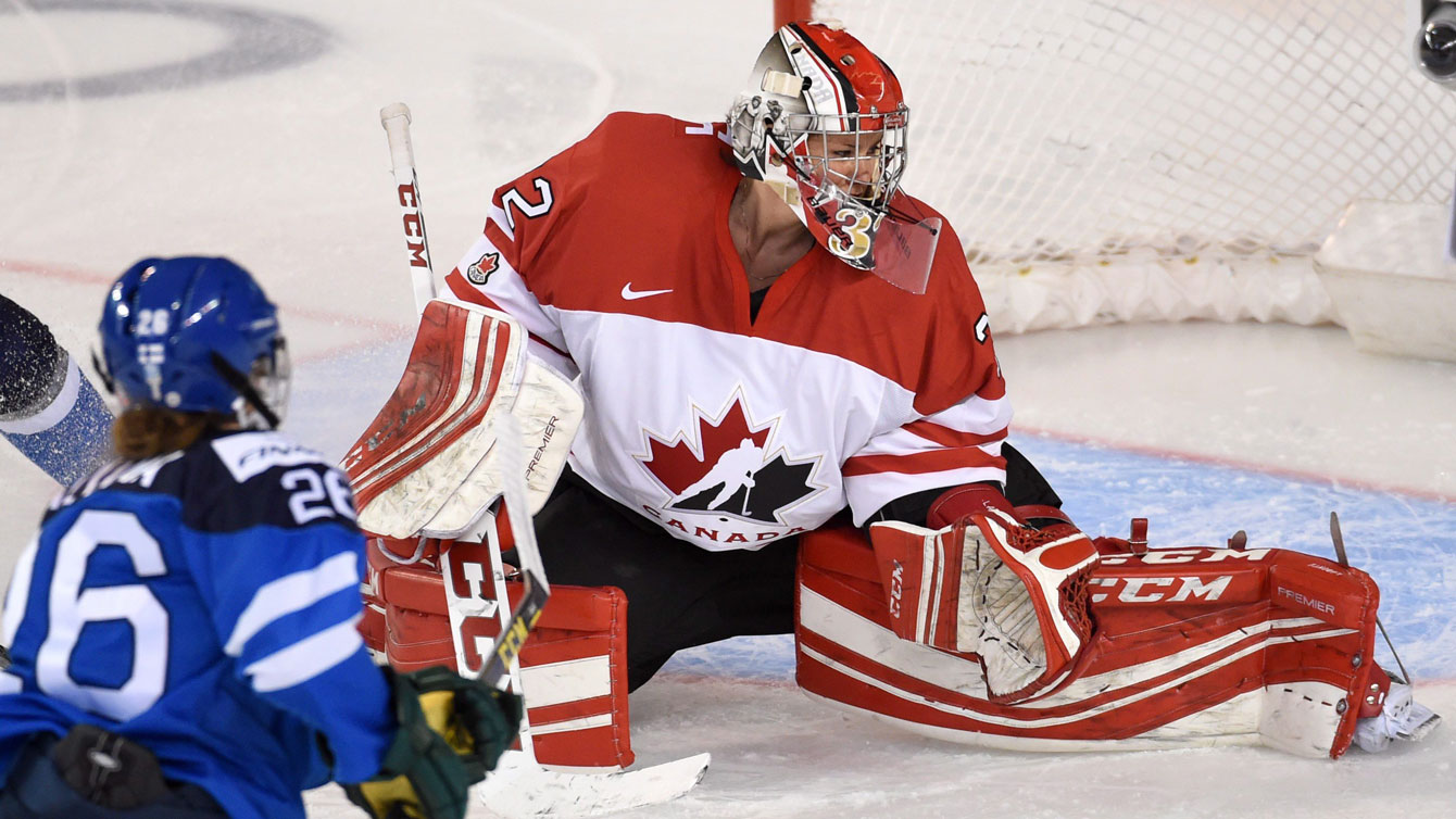 Saana Valkama of Finland scores the game's first goal against Canadian goaltender Charline Labonte at the IIHF women's world championship semifinal on April 3, 2016.
