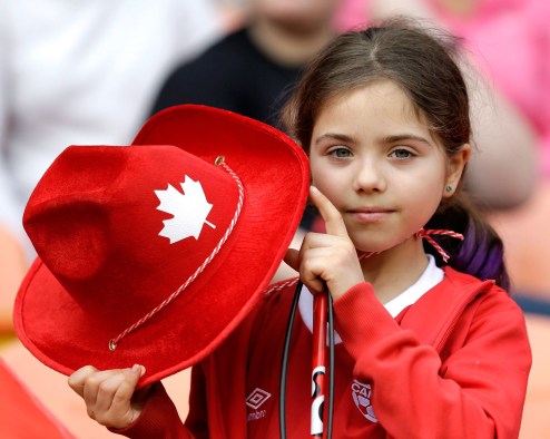 A young fan shows her support for Canada as the women's soccer team takes the field for a CONCACAF Olympic qualifying tournament soccer match. (AP Photo/David J. Phillip)