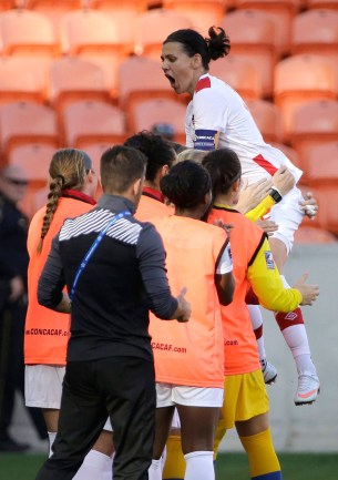 10805637 Canada's Christine Sinclair, right, leaps onto teammates as she celebrates after scoring a goal against Costa Rica during the first half of a CONCACAF Olympic women's soccer qualifying championship semifinal Friday, Feb. 19, 2016, in Houston. (AP Photo/David J. Phillip)