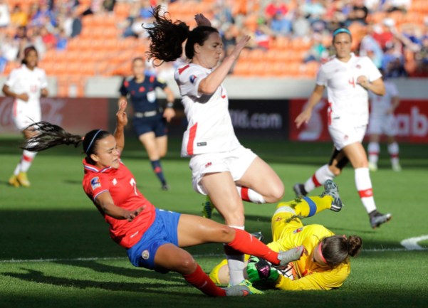 10805638 Canada goalkeeper Erin McLeod, right, grabs the ball as Allysha Chapman (2) avoids her as Costa Rica's Melissa Herrera (7) slides during the first half of a CONCACAF Olympic women's soccer qualifying championship semifinal Friday, Feb. 19, 2016, in Houston. (AP Photo/David J. Phillip)