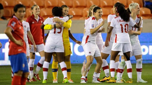 Canada players celebrate after beating Costa Rica in a CONCACAF Olympic women's soccer qualifying championship semifinal Friday, Feb. 19, 2016, in Houston. Canada won 3-1. (AP Photo/David J. Phillip)