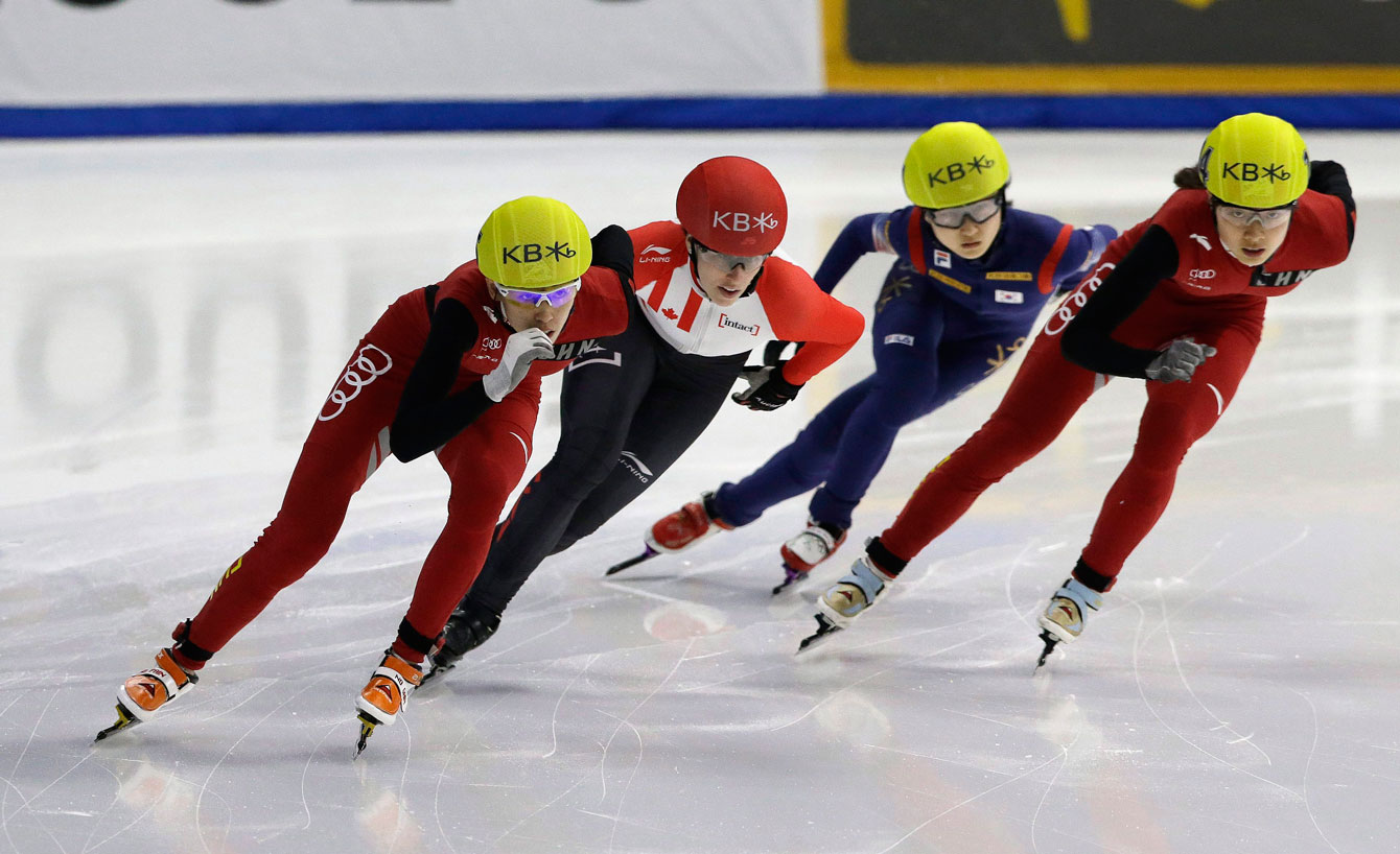 Wang Lexin of China competes against Marianne St-Gelais of Canada