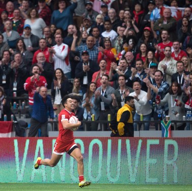 Canada's Nathan Hirayama runs the ball in for a try against England during World Rugby Sevens Series' Canada Sevens bowl semi-final action, in Vancouver, B.C., on Sunday March 13, 2016. THE CANADIAN PRESS/Darryl Dyck