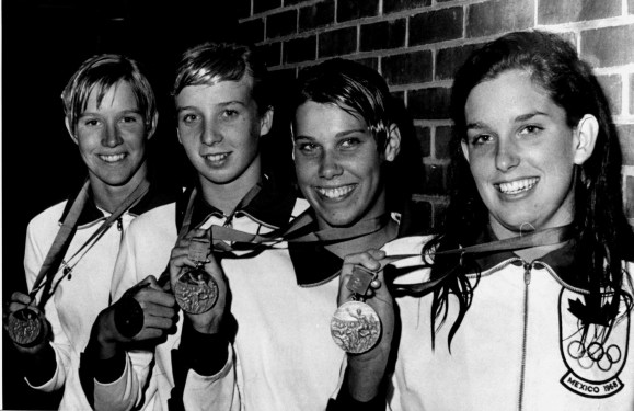 Four women hold their medals