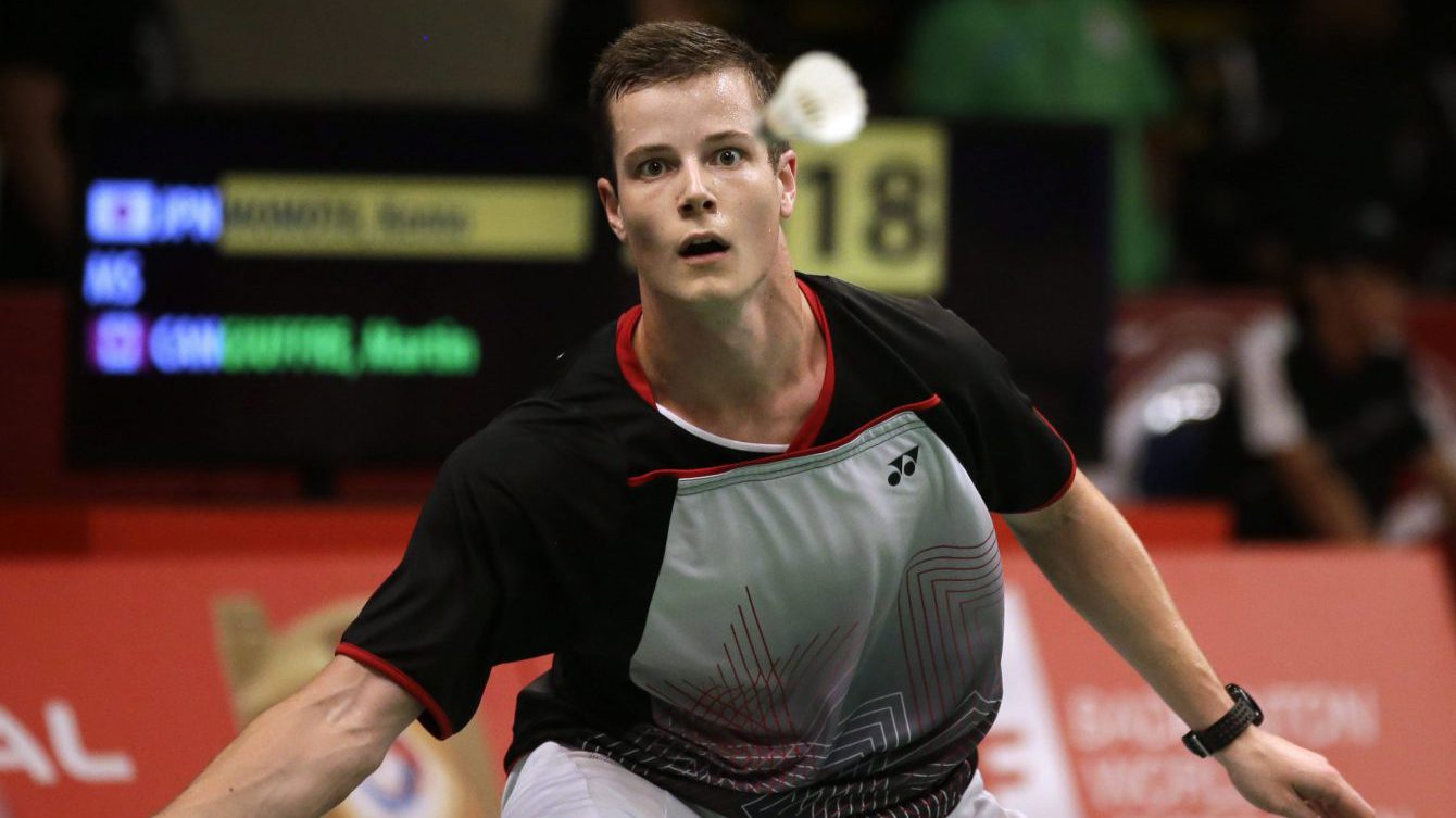 Canada's Martin Giuffre prepares to return a shot to Japan's Kento Momota during their men's singles match at the Badminton World Federation championships at Istora Stadium in Jakarta, Indonesia, Wednesday, Aug. 12, 2015. (AP Photo/Achmad Ibrahim)