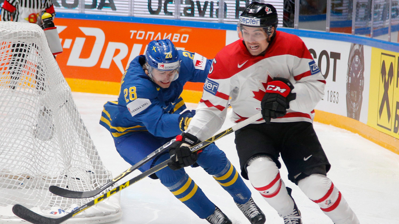 Canada’s Cody Ceci, right, fights for the puck with Sweden’s Johan Sundstrom during the Hockey World Championships quarterfinal match between Canada and Sweden in St.Petersburg, Russia, Thursday, May 19, 2016. (AP Photo/Dmitri Lovetsky)