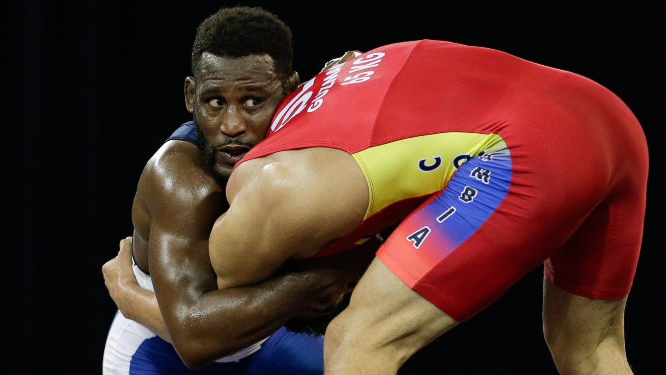 Haislan Garcia wrestles Colombia's Hernan Guzman at the the Pan Am Games in Mississauga on July 17, 2015. (AP Photo/Gregory Bull)