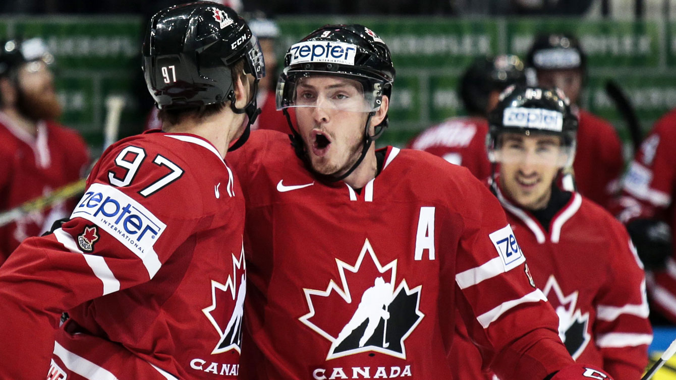 Connor McDavid (left) and Matt Duchene celebrate McDavid's first period goal at the IIHF worlds final on May 22, 2016.