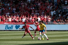 A Brazilian player dribbling with the ball