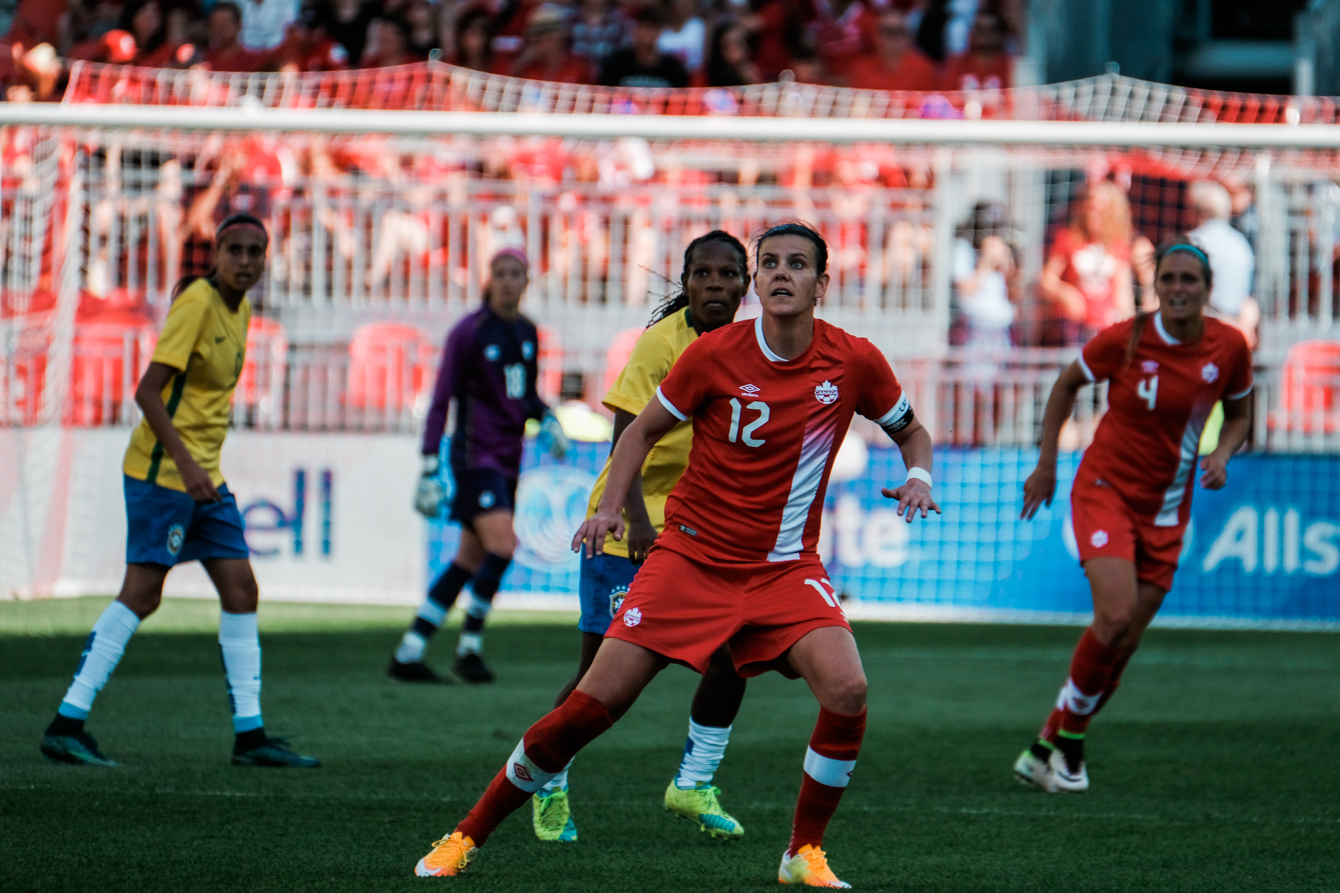 Christine Sinclair (in red) captained Canada and played 74 minutes against Brazil on June 4, 2016.  (Thomas Skrlj/COC)