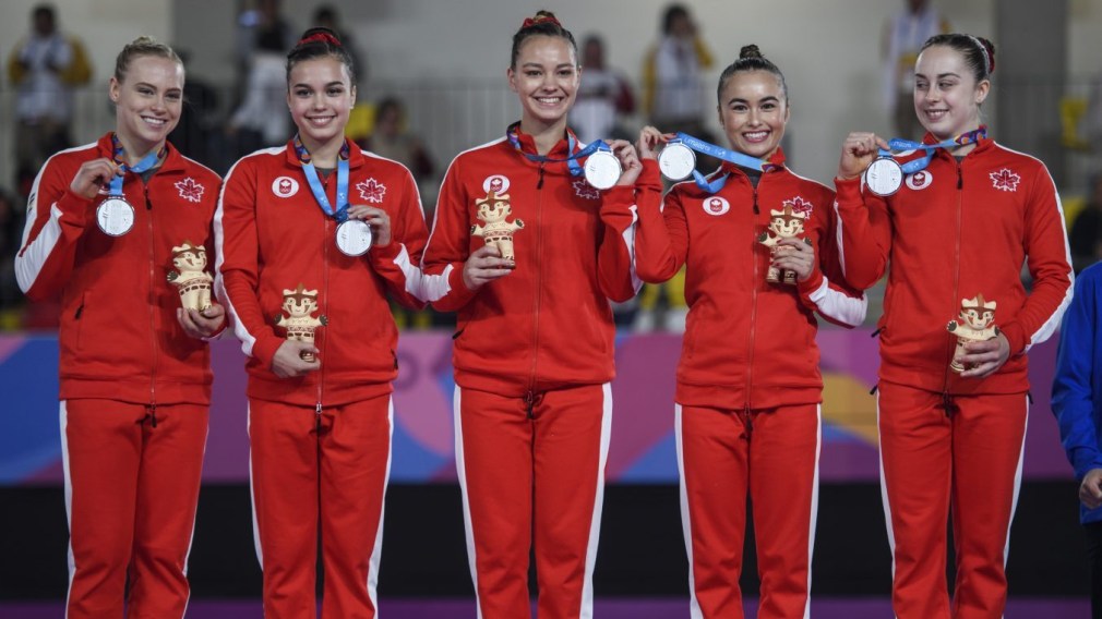 Canadian artistic gymnastics team members on podium