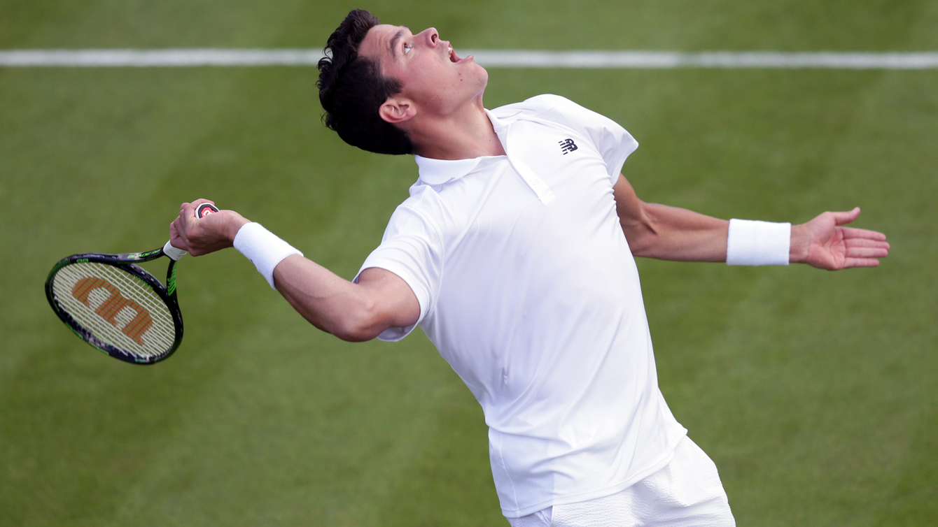 Milos Raonic of Canada serves to Pablo Carreno Busta of Spain during their men's singles match on day one of the Wimbledon Tennis Championships in London, Monday, June 27, 2016. (AP Photo/Tim Ireland)