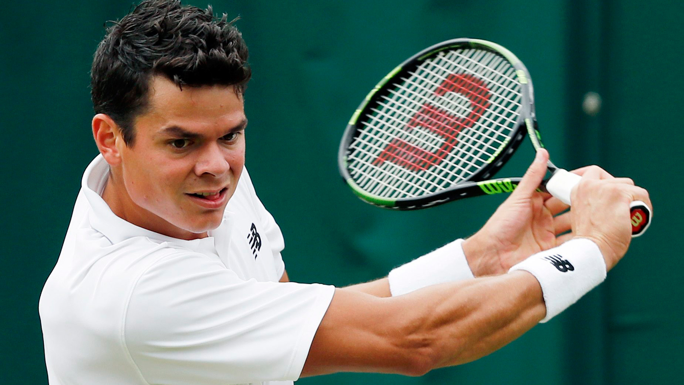 Milos Raonic of Canada returns to Andreas Seppi of Italy during their men's singles match on day four of the Wimbledon Tennis Championships in London, Thursday, June 30, 2016. (AP Photo/Ben Curtis)