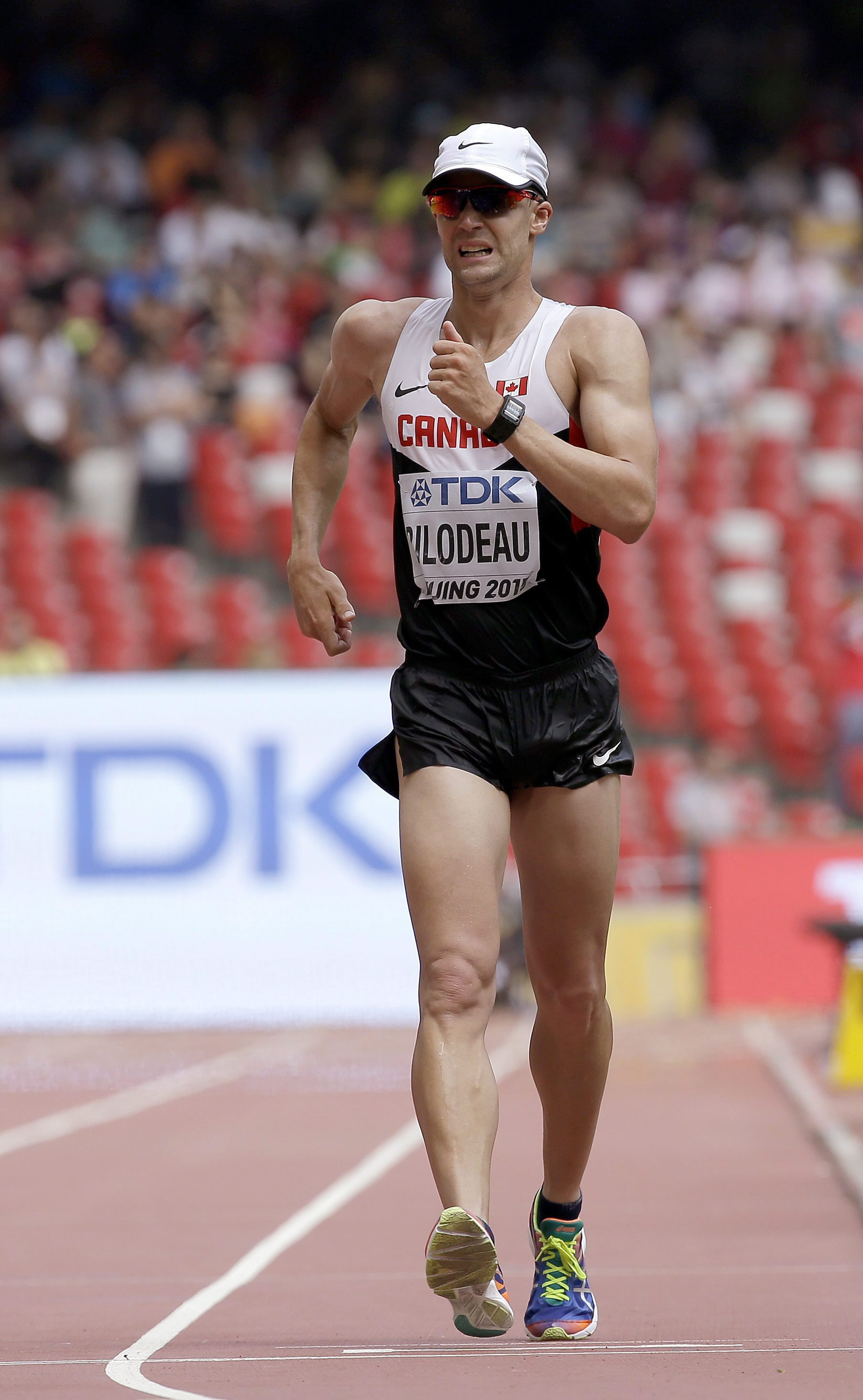 Canada's Mathieu Bilodeau competes in the mens 50km race walk final at the World Athletics Championships at the Bird's Nest stadium in Beijing, Saturday, Aug. 29, 2015. (AP Photo/David J. Phillip)