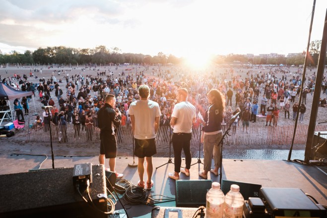 Athletes being interviewed on stage just before the sun set. (Thomas Skrlj/COC)