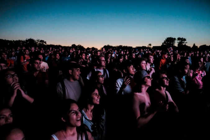 Beach Party Attendees watching the Team Canada Ice in Our Veins promo. (Thomas Skrlj/COC)