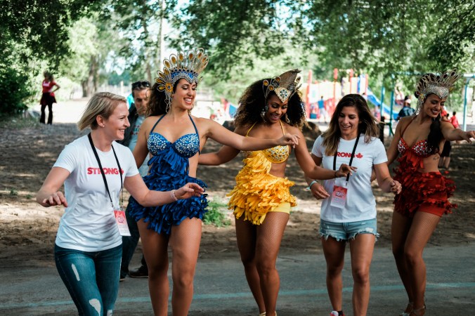 Wrestlers Jillian Gallays and Michelle Fazzari Samba with Brazilian Dancers. July 1, 2016. (Thomas Skrlj/COC)