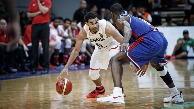 Cory Joseph dribbles around defender