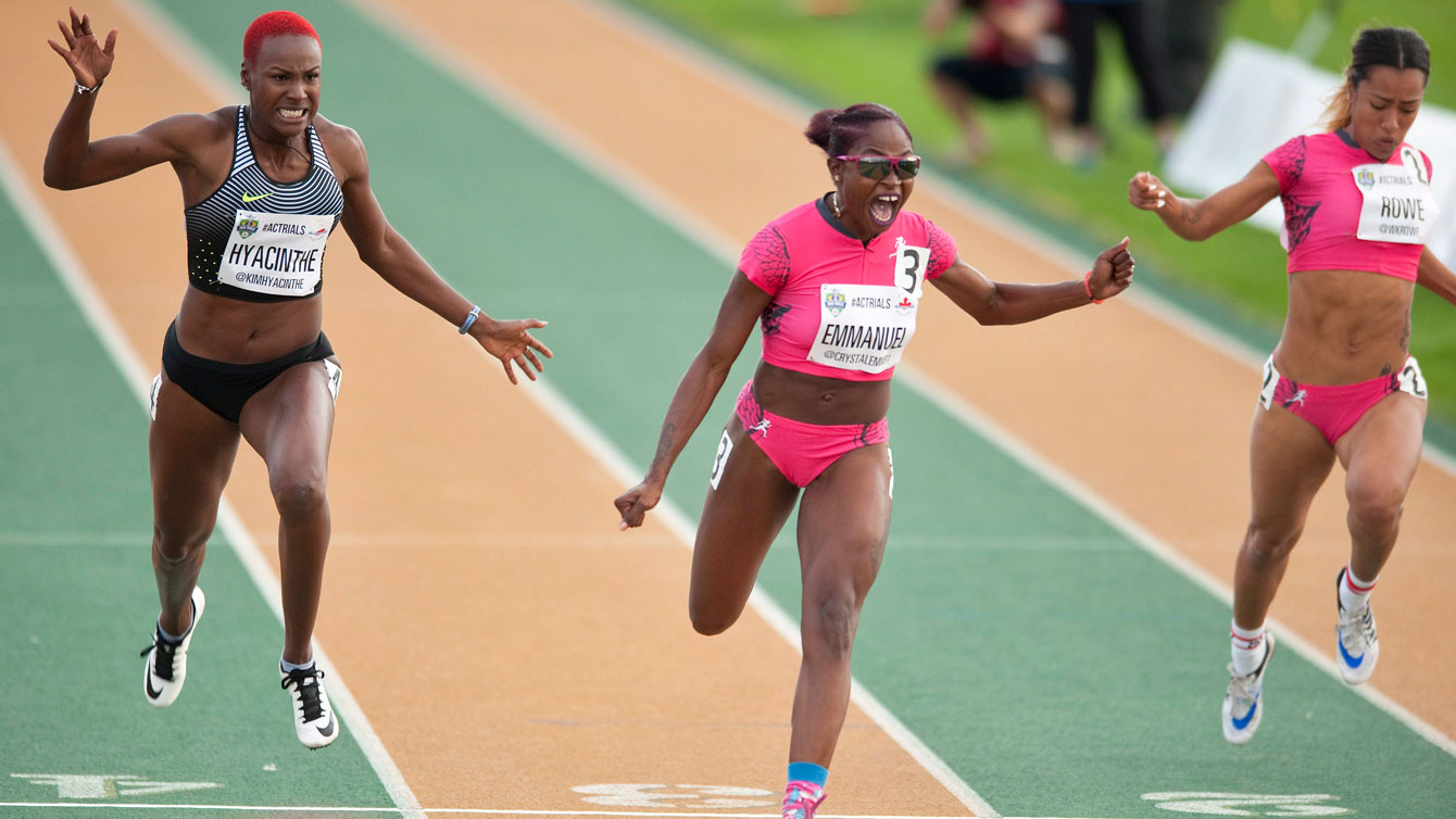 Crystal Emmanuel (centre) after realizing she won the women's 100m at Athletics Canada Olympic trials on July 9, 2016. 