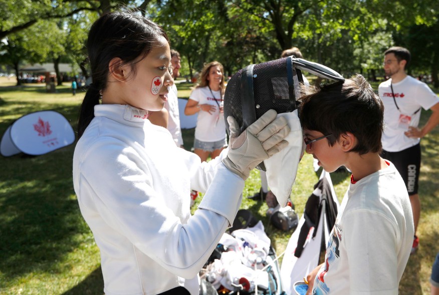 A child gets ready to fence at the Canadian Tire sport demonstration at the Beach Party.