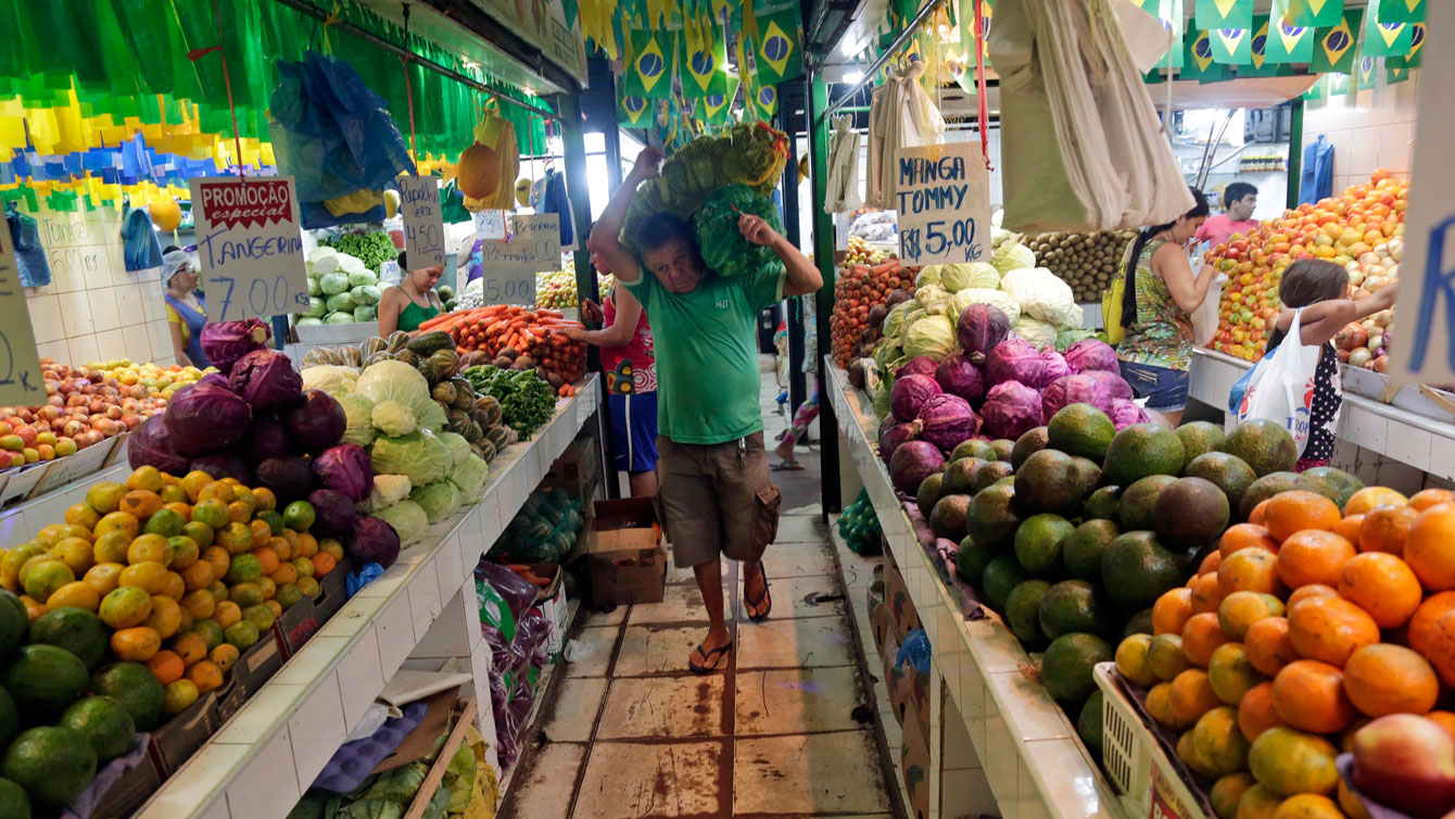 Fruits and vegetables are sold in a market in Manaus, Brazil, one of the host cities for the 2014 soccer World Cup in Tuesday, June 24, 2014. (AP Photo/Marcio Jose Sanchez)