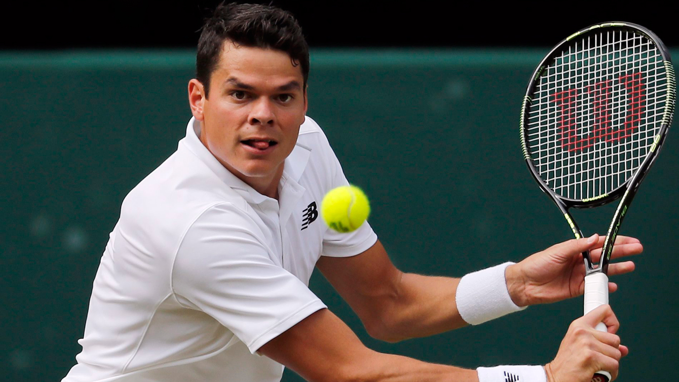 Milos Raonic of Canada returns to Andy Murray of Britain during the men's singles final on the fourteenth day of the Wimbledon Tennis Championships in London, Sunday, July 10, 2016. (AP Photo/Ben Curtis)
