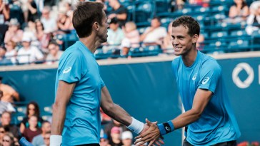 Canada's Daniel Nestor (left) and Vasek Pospisil (right) celebrate a point in the semifinals of the Rogers Cup on July 30, 2016 in Toronto. (Thomas Skrlj/COC)