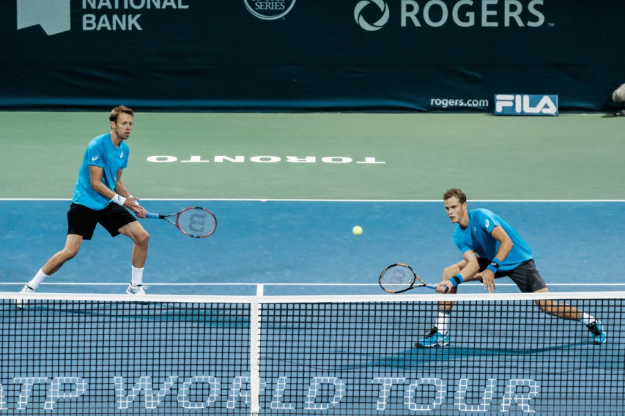 Canada’s Vasek Pospisil and Daniel Nestor play doubles in the quarterfinals of the Rogers Cup in Toronto on July 29, 2016. (Thomas Skrlj/COC)