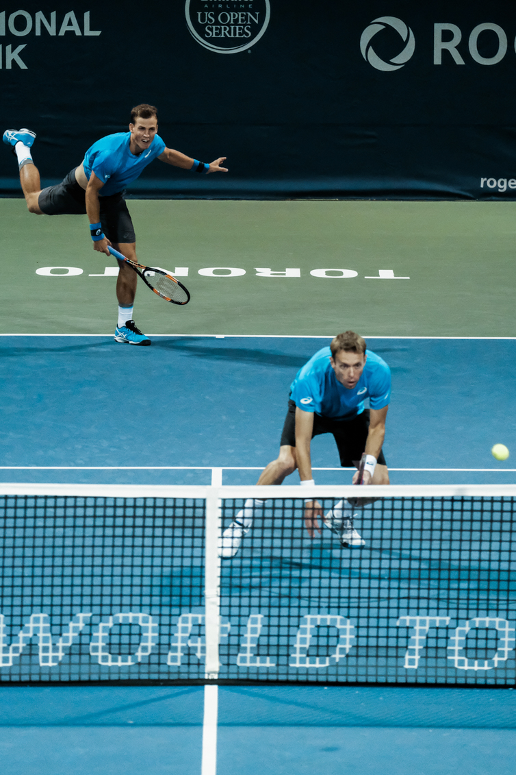Canada’s Vasek Pospisil and Daniel Nestor play doubles in the quarterfinals of the Rogers Cup in Toronto on July 29, 2016. (Thomas Skrlj/COC)