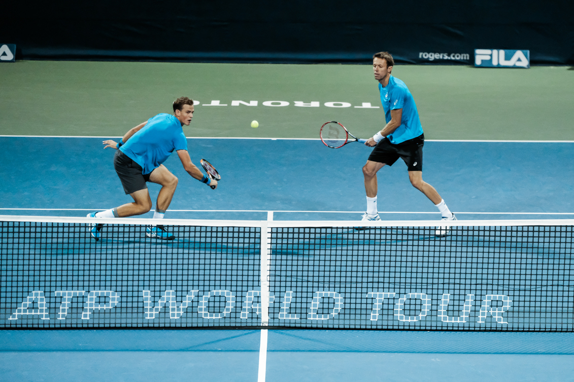 Canada’s Vasek Pospisil and Daniel Nestor play doubles in the quarterfinals of the Rogers Cup in Toronto on July 29, 2016. (Thomas Skrlj/COC)