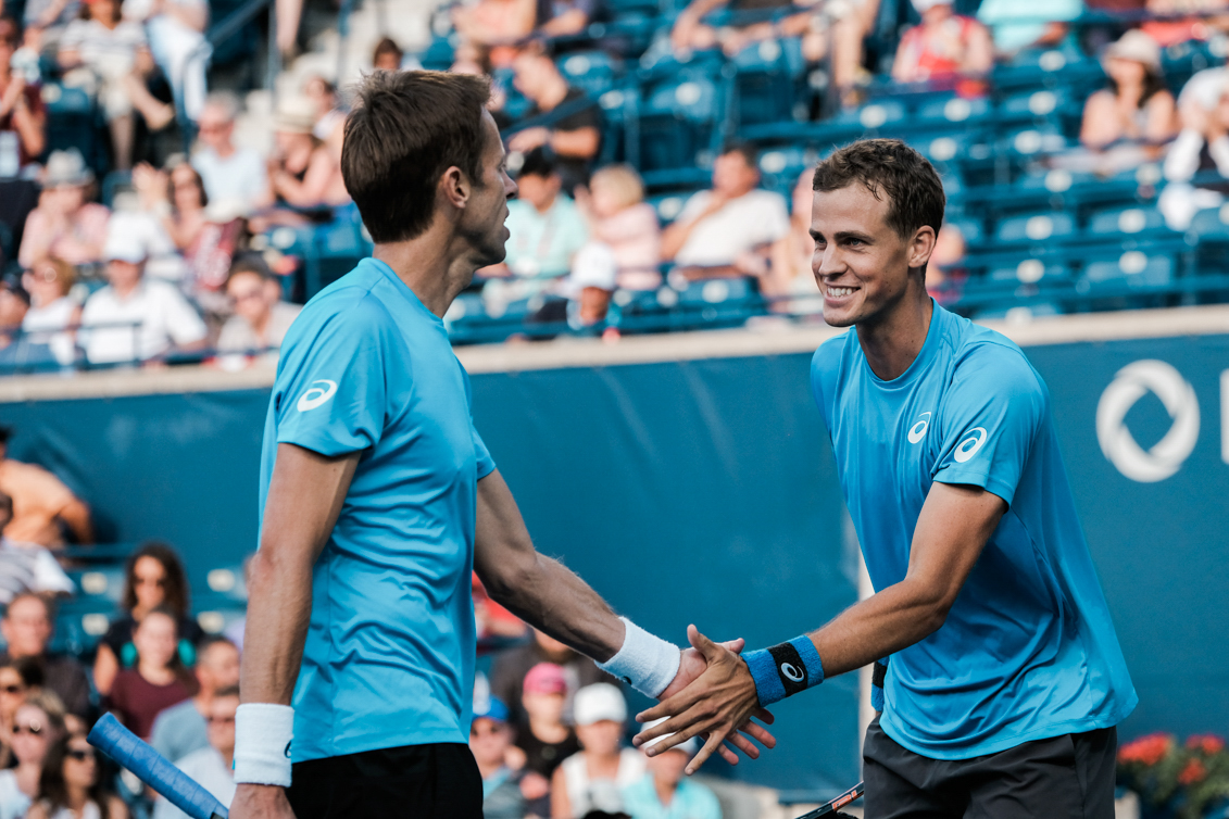 Canada’s Vasek Pospisil and Daniel Nestor play doubles in the semifinals of the Rogers Cup in Toronto on July 30, 2016. (Thomas Skrlj/COC)