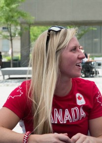 Kayla Moleschi singing autographs for fans after the Team Canada rugby send-off on July 26, 2016. (Tavia Bakowski/COC)