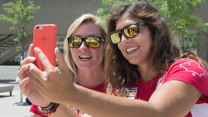 Kayla Moleschi and Bianca Farella taking a snapchat after the Team Canada Rugby send-off celebration on July 26, 2016. (Tavia Bakowski/COC)
