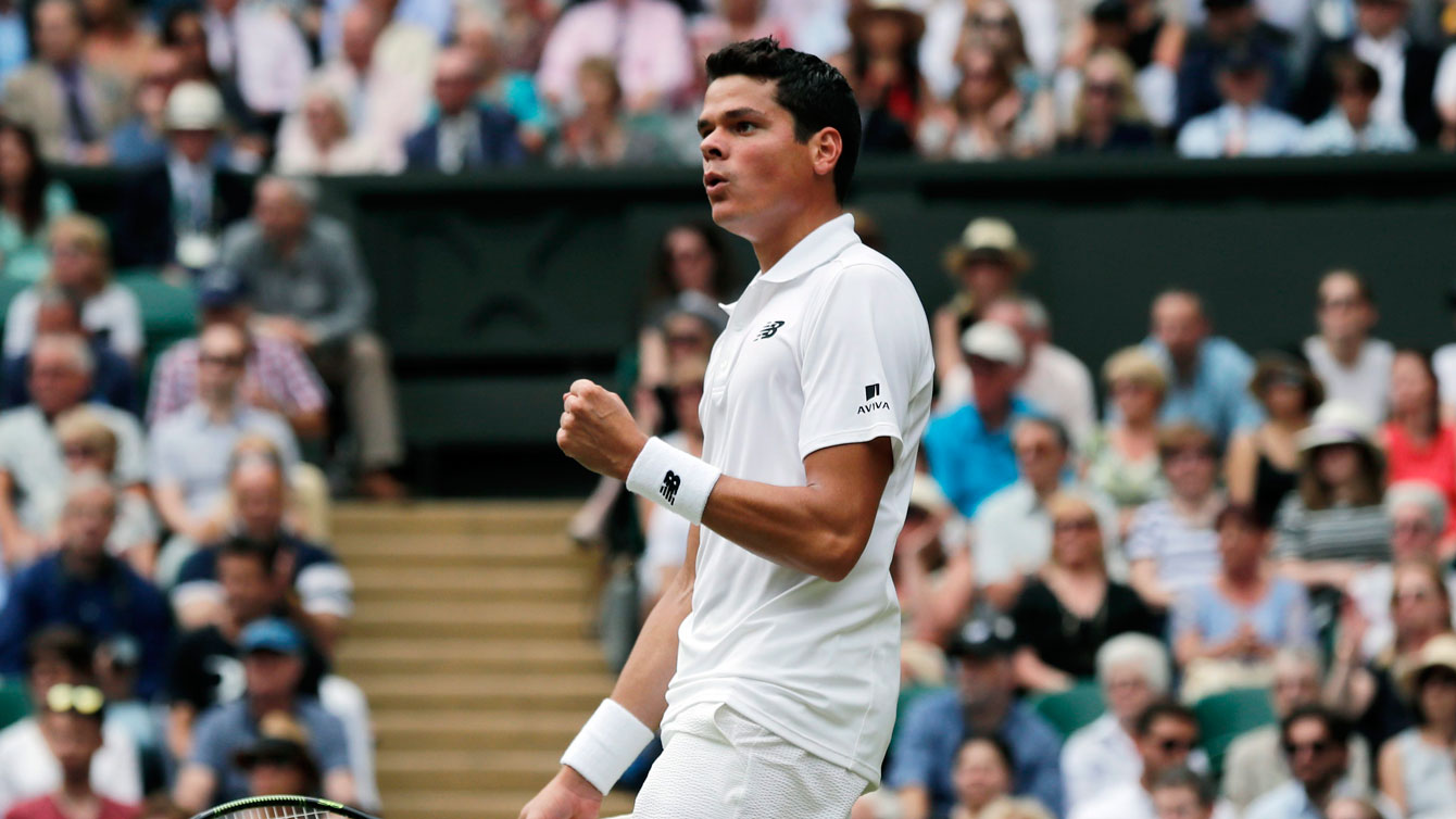 Milos Raonic celebrates a point against Roger Federer at their Wimbledon semifinal on July 8, 2016.