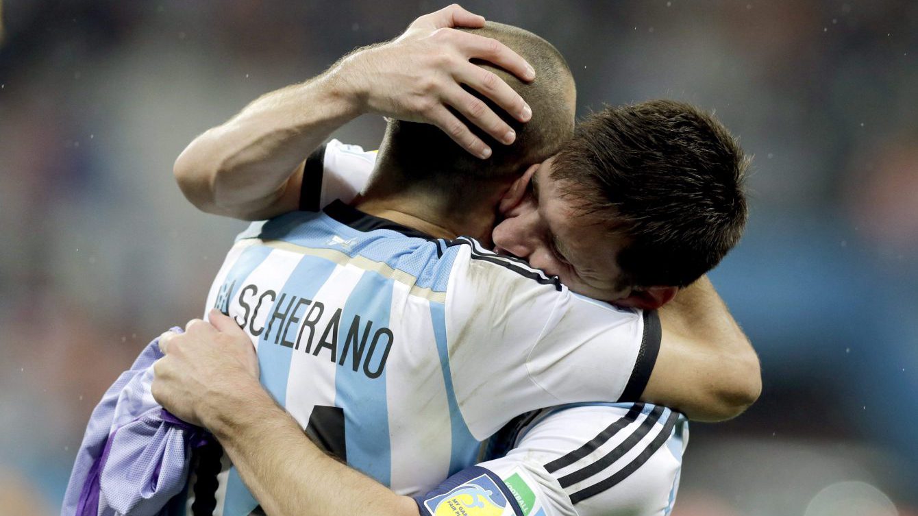 FILE - In this July 9, 2014, file photo, Argentina's Lionel Messi, right, hugs Javier Mascherano after Argentina defeated the Netherlands 4-2 in a penalty shootout after a 0-0 tie after extra time to advance to the finals during the World Cup semifinal soccer match between the Netherlands and Argentina at the Itaquerao Stadium in Sao Paulo Brazil. (AP Photo/Victor R. Caivano, File)