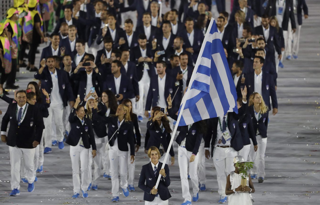 Sofia Bekatorou carries the flag of Greece during the opening ceremony for the 2016 Summer Olympics in Rio de Janeiro, Brazil, Friday, Aug. 5, 2016. (AP Photo/Matt Slocum)