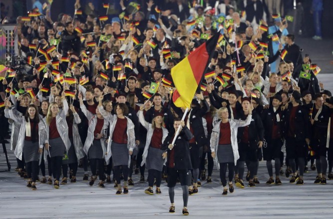 Timo Boll carries the flag of Germany during the opening ceremony for the 2016 Summer Olympics in Rio de Janeiro, Brazil, Friday, Aug. 5, 2016. (AP Photo/Matt Slocum)