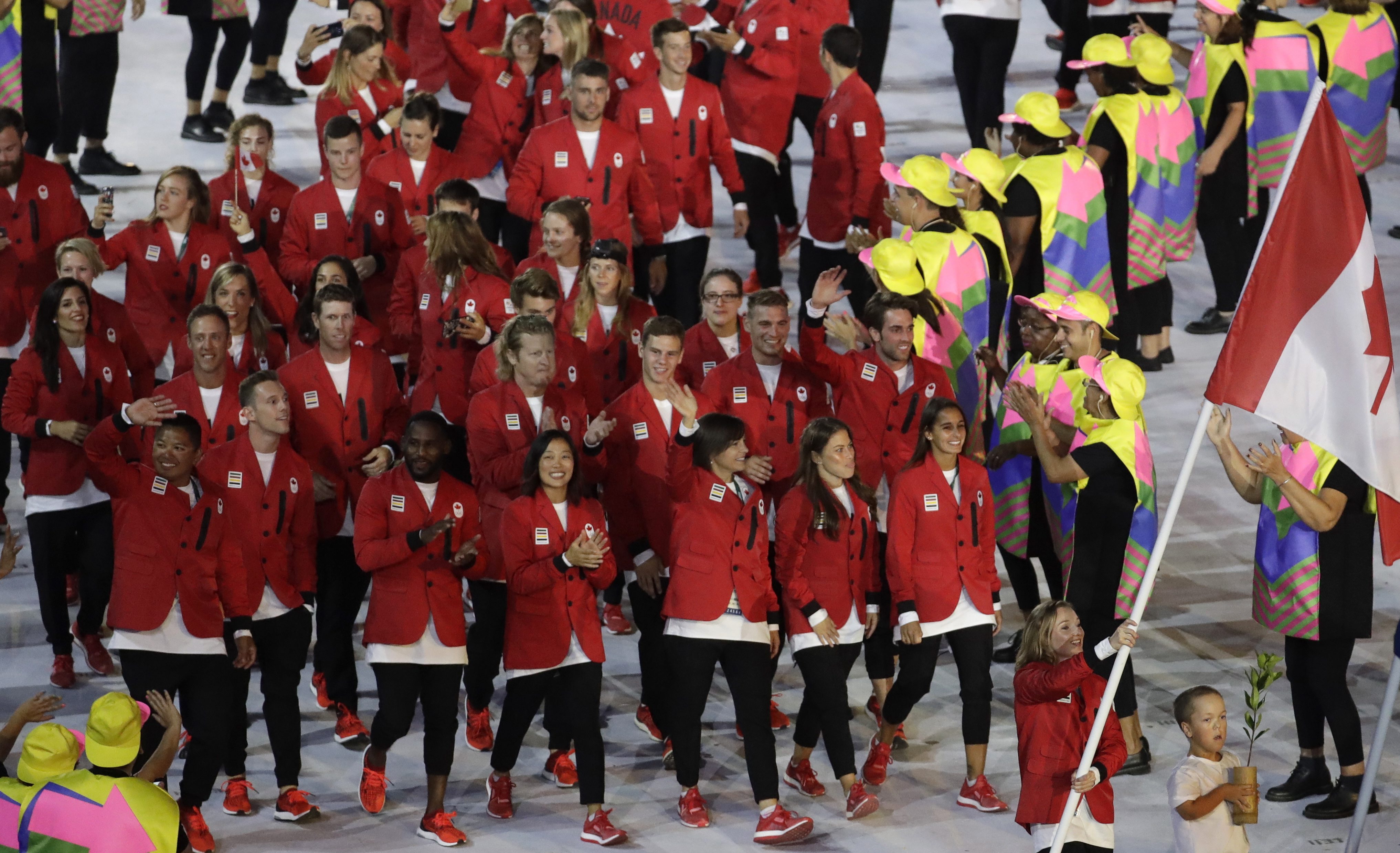 Rosannagh Maclennan carries the flag of Canada during the opening ceremony for the 2016 Summer Olympics in Rio de Janeiro, Brazil, Friday, Aug. 5, 2016. (AP Photo/Patrick Semansky)