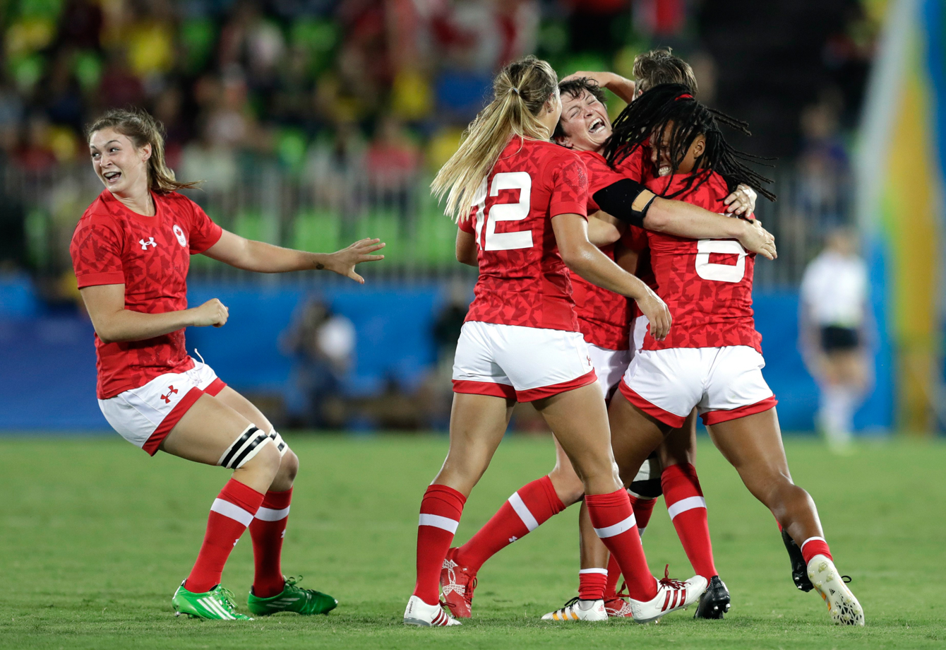 Canada's players celebrates after winning the the women's rugby sevens bronze medal match against Great Britain at the Summer Olympics in Rio de Janeiro, Brazil, Monday, Aug. 8, 2016. (AP Photo/Themba Hadebe)