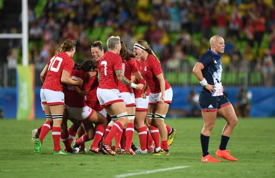 Jen Kish Heather Fisher Karen Paquin Canada's captain Jen Kish (7) screams in joy with teammate Karen Paquin, middle right, as Great Britain's Heather Fisher walks off the field during the bronze medal match in women's rugby sevens at the 2016 Olympic Summer Games in Rio de Janeiro, Brazil on Monday, Aug. 8, 2016. Canada defeated Britain to be come the first medal winner in Olympic womens rugby sevens. THE CANADIAN PRESS/Sean Kilpatrick