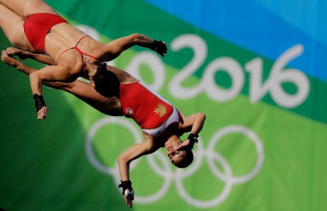 Canada's Meaghan Benfeito and Roseline Filion warm up ahead of the women's synchronized 10-meter platform diving final in the Maria Lenk Aquatic Center at the 2016 Summer Olympics in Rio de Janeiro, Brazil, Tuesday, Aug. 9, 2016. (AP Photo/Wong Maye-E)