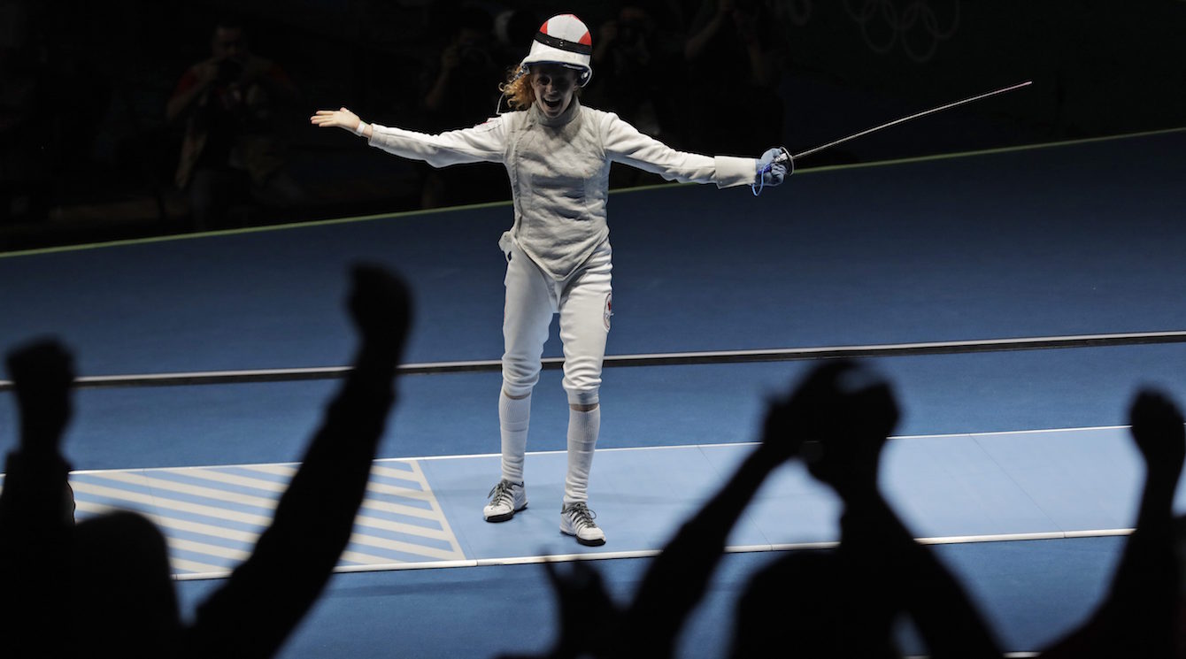 Eleanor Harvey of Canada celebrates after defeating Arianna Errigo of Italy in a women's individual foil event at the 2016 Summer Olympics in Rio de Janeiro, Brazil, Wednesday, Aug. 10, 2016. (AP Photo/Andrew Medichini)