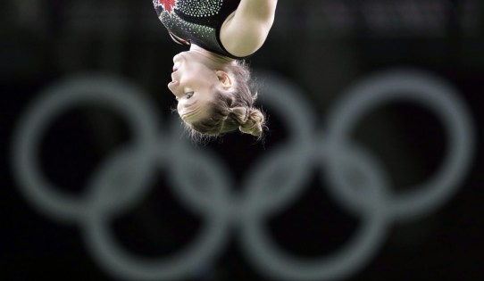 Rosie MacLennan during Rio 2016 Olympic trampoline qualifications on August 12, 2016. (AP Photo/Julio Cortez)