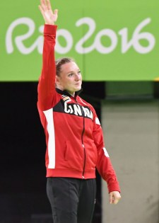Canada's Rosie MacLennan, from King City, Ont., acknowledges the crowd following her gold medal winning routine in the final of the trampoline gymnastics competition at the 2016 Summer Olympics Friday, August 12, 2016 in Rio de Janeiro, Brazil.THE CANADIAN PRESS/Ryan Remiorz